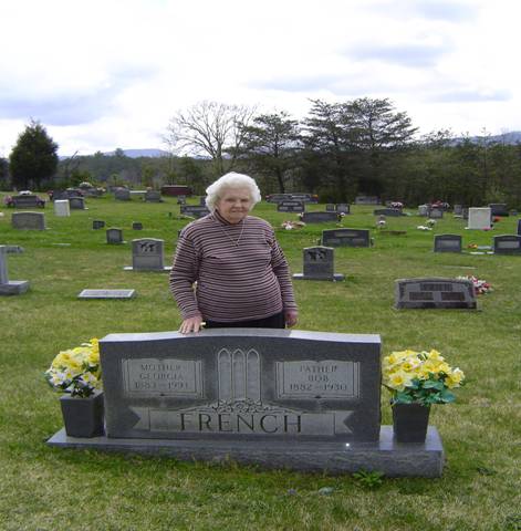 Mrs. Farmer at parents' graves