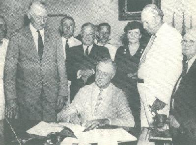 President Roosevelt signing the SS Act into Law